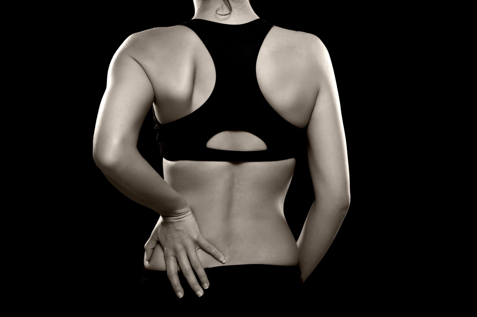 esportista que té dolor de fibromiàlgia lumbar