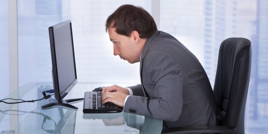man with a hunched posture who should straighten his back