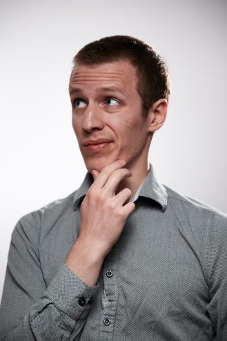 A man wearing a gray shirt
