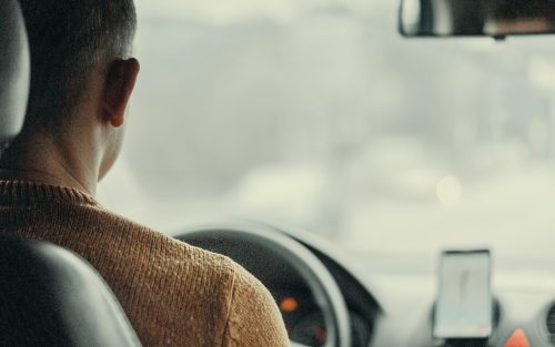 A man drives a car